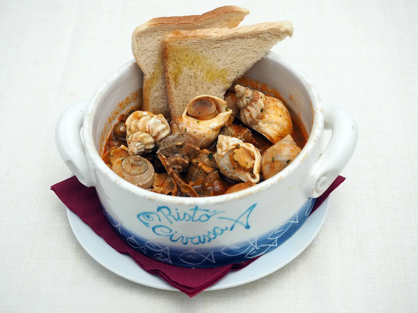 Lumache di mare in umido